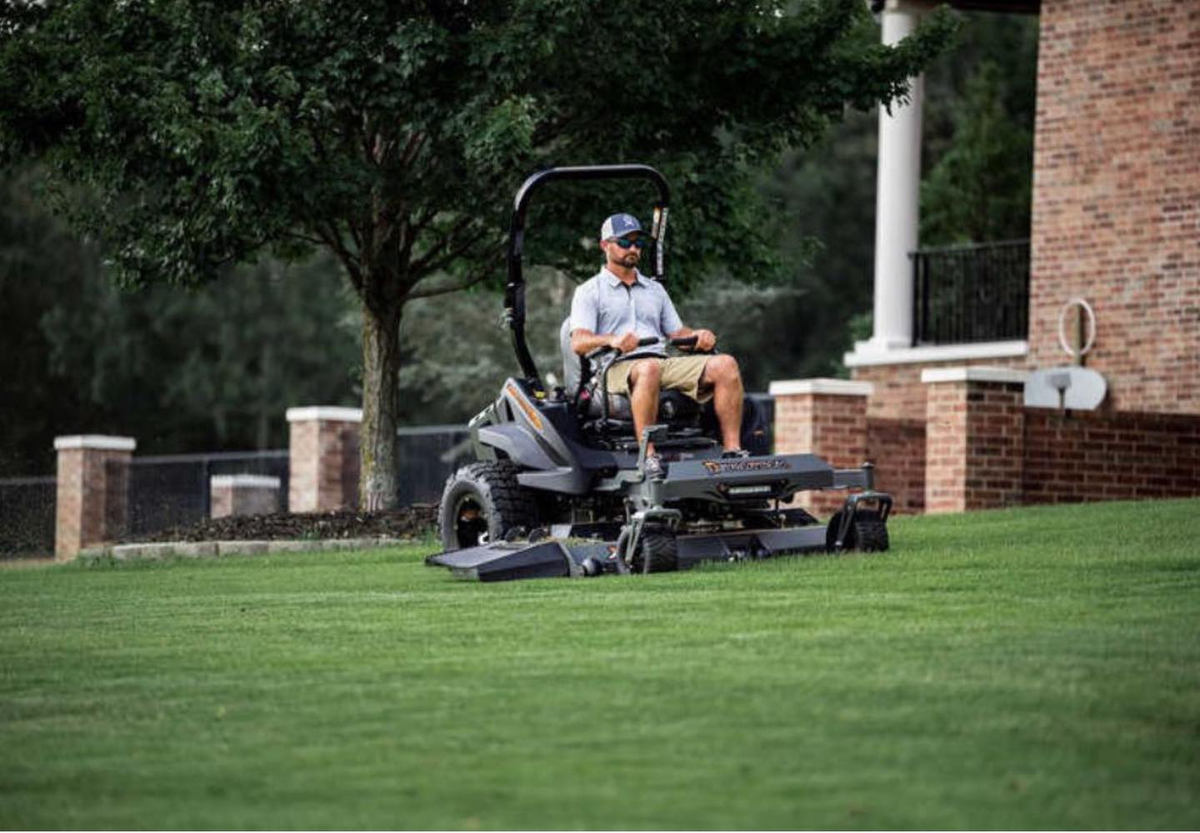 Professional lawn care service in action